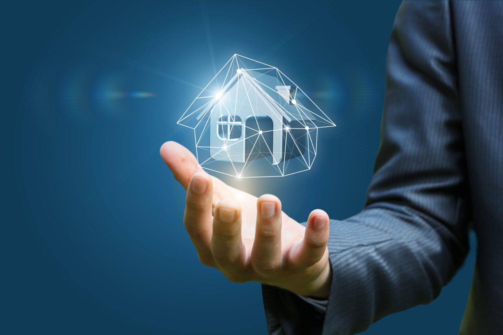 Real estate agent holding a model house . Hand holding holographic house model.