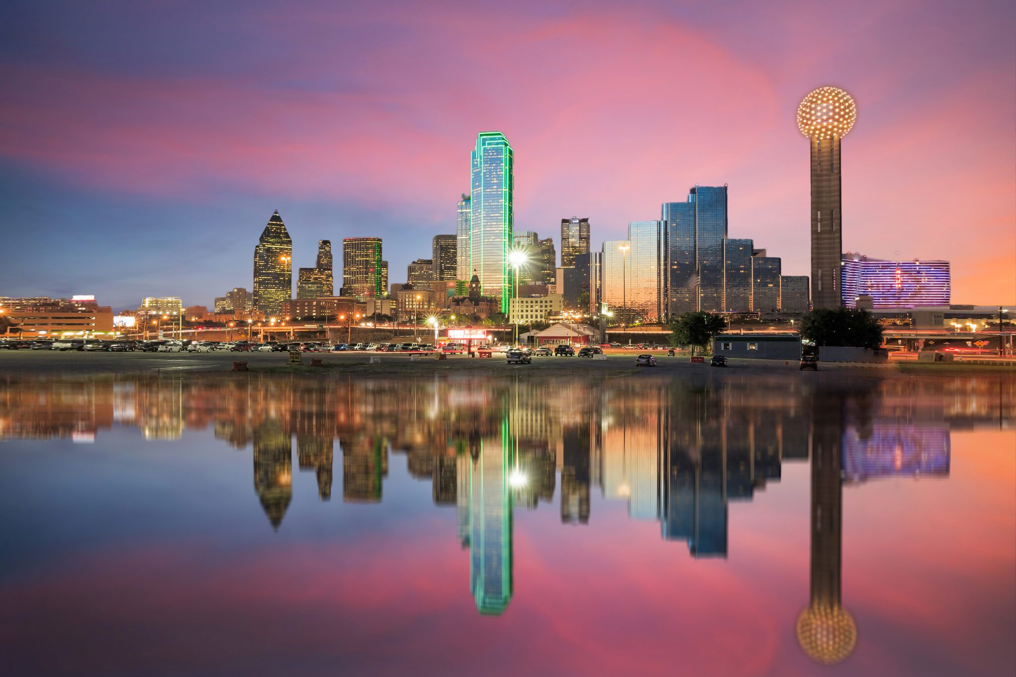 Dallas skyline reflected in the Trinity River at sunset.